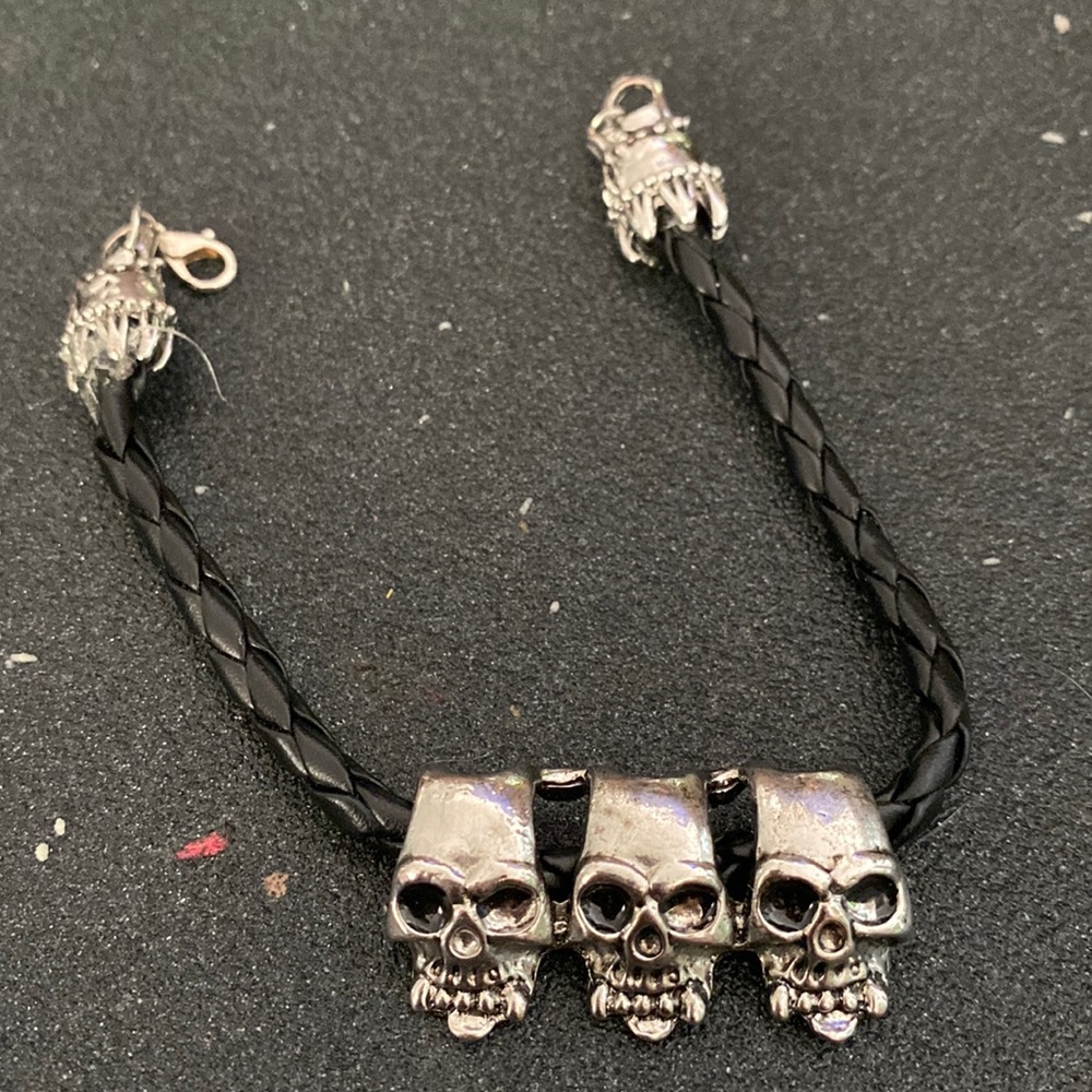 Black braided rope skull bracelet with silver hardware